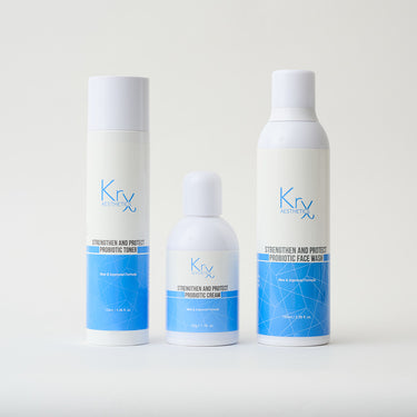 skincare bottles lined up next to each other with white packaging