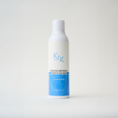 white bottle of facial wash with blue label