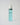 bottle of blue skincare liquid in a spray bottle