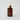 amber glass bottle with facial serum inside 