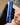 hand holding blue skincare product above a face